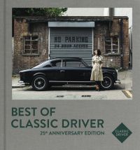 Mai Ikuzawa in beige trench coat, standing next to black Lancia Aurelia B20 GT, on grey linen cover of 'Best of Classic Driver, 25th Anniversary Edition', by Delius Klasing Verlag.