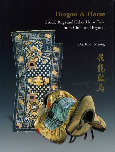 Chinese horse saddle with gold embroidered silk, navy rug behind, on cover of 'Dragon & Horse', by CA Book Publishing.