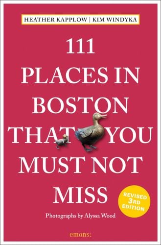 Bronze duck and duckling, near centre of red cover of '111 Places in Boston That You Must Not Miss, by Emons Verlag.