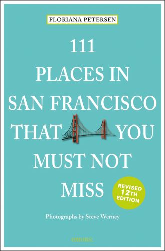 Golden Gate Bridge, to centre of mint green travel guide cover, '111 Places in San Francisco That You Must Not Miss' by Emons Verlag.