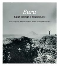 Book cover of Sura, Egypt from a Belgian Perspective, with a person standing on desert ruins, with a pyramid in the distance. Published by Exhibitions International.