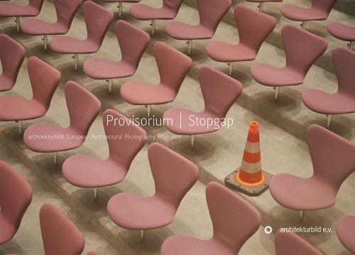 Rows of pale pink chairs with one replaced by orange and white striped traffic cone, on cover of 'Provisorium / Stopgap, European Architectural Photography Prize 2023', by Avedition.