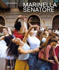Group of dancers in town square, one in white tutu, on cover of 'Marinella Senatore', by Silvana.
