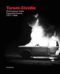 Book cover of Taroni-Cividin, Performance, Video, Expanded Cinema (1977-1984), with an old car on fire. Published by Silvana.
