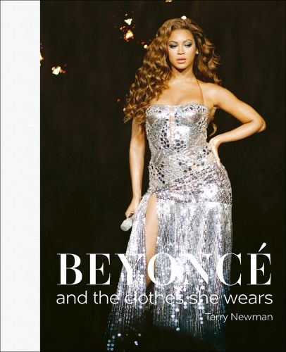Beyoncé performing on stage in a silver mirrored dress, on cover of 'Beyoncé, and the clothes she wears', by ACC Art Books.