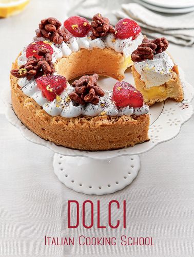 White plate with a dessert with raspberries arranged in a crescent shape to left side, on cover of 'Italian Cooking School: Dolci', by White Star.