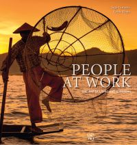 Intha fisherman standing on end of boat with large net, sunset behind, on cover of 'People at Work, The Art of Living and Surviving', by White Star.