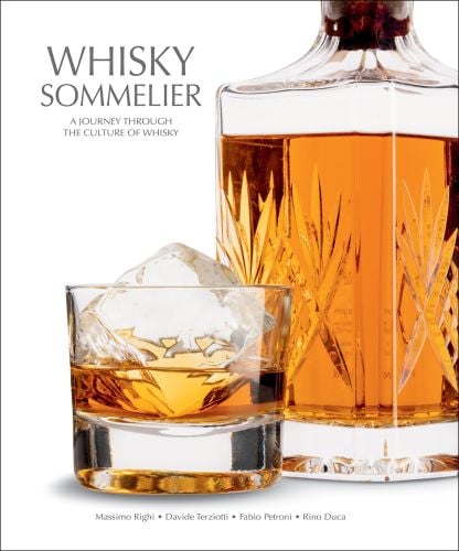 Glass of whisky with an ice cube, and crystal decanter, on white cover of 'Whisky Sommelier, A Journey Through the Culture of Whisky', by White Star.