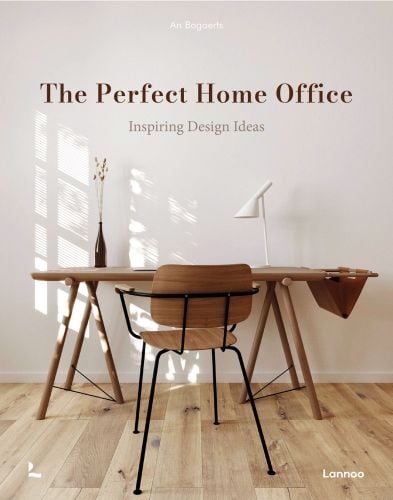 Book cover of An Bogaerts' The Perfect Home Office: Inspiring Design Ideas, with wooden desk with white lamp, and chair. Published by Lannoo Publishers.