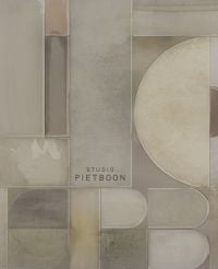 Beige shapes on cover of '40 by Studio Piet Boon', by Lannoo Publishers.