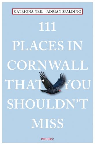 Black Cornish crown, near center of sky blue cover of '111 Places in Cornwall That You Shouldn't Miss', by Emons Verlag.