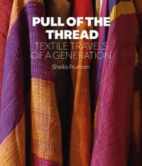 Book cover of Sheila Fruman’s Pull of the Thread, Textile Travels of a Generation, with colourful checked fabric in purple, pink and orange. Published by Hali Publications.