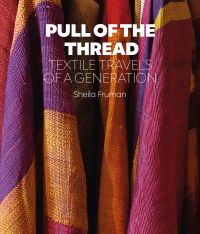 Book cover of Sheila Fruman’s Pull of the Thread, Textile Travels of a Generation, with colorful checked fabric in purple, pink and orange. Published by Hali Publications.