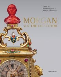 Gold carriage clock with red bust on top, on cover of 'MORGAN –The Collector Essays in Honor of Linda Roth’s 40th Anniversary at the Wadsworth Atheneum Museum of Art', by Arnoldsche Art Publishers.
