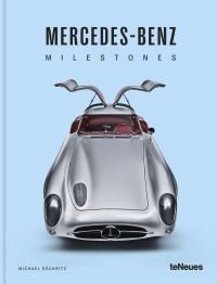 Book cover of Michael Köckritz's car guide, Mercedes-Benz Milestones, featuring a silver Mercedes-Benz 300 SLR gullwing Uhlenhaut, with doors open. Published by White Star.