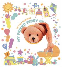 Furry brown bear toy poking out of white keepsake album cover of 'My First Memories, Book and Teddy Bear Gift Set', by White Star.