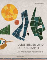 Glazed ceramic pieces on white wall, of yellow circle with dark blue and green abstract shapes, on cover of 'Julius Bissier und Richard Bampi, Das Freiburger Keramikbild', by Arnoldsche Art Publishers.