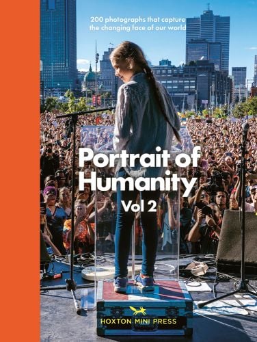 Activist Greta Thunberg standing on stage addressing a large crowd, on cover of 'Portrait of Humanity Vol 2, 200 Photographs That Capture the Changing Face of Our World', by Hoxton Mini Press.