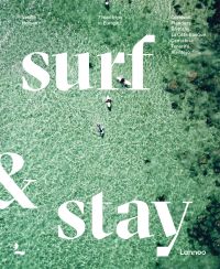 Aerial view of pale green sea with surfers on boards, on cover of 'Surf & Stay', by Lannoo Publishers.