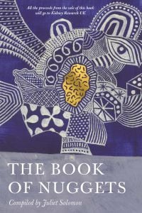 Blue textile fabric featuring white patterned face and gold nugget, on cover of 'The Book of Nuggets', by Goodkind Publishing.
