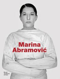 Book cover of art exhibition catalogue of Marina Abramovi?, featuring the Serbian artist in straight-jacket, staring sternly at the viewer. Published by Royal Academy of Arts.