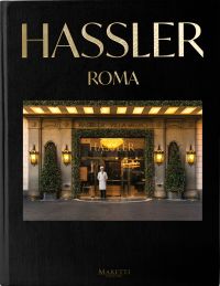 Book cover of Hassler Roma: 1893-2023 130th Anniversary, with the front of hotel with a chef standing near entrance. Published by Manfredi Edizioni.