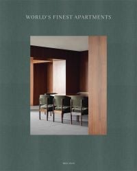 Green linen book cover of World's Finest Apartments, with interior dining space with dark wood veneered walls, long table with green, velvet covered chairs. Published by Beta-Plus.
