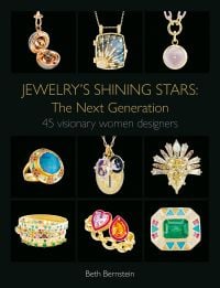 Highly decorative pieces of gold jewellery with coloured jewels, on black cover of 'Jewelry's Shining Stars: The Next Generation, 45 Visionary Women Designers', by ACC Art Books.