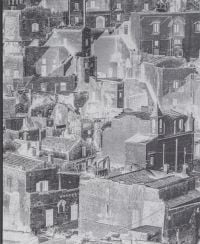 Book cover of Stefano De Luigi's Il Bel Paese, with the tops of houses and streets. Published by L'Artiere.