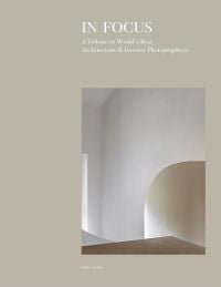 Book cover of In Focus: A Tribute to World's Best Architecture & Interior Photographers, with a pale interior wall arch. Published by Beta-Plus.