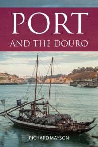 Book cover of Richard Mayson's study, Port and the Douro, with a Rabelo boat with barrels of Porto wine aboard. Published by Academie du Vin Library.