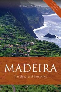 Book cover of Richard Mayson's guide, Madeira, The Islands and Their Wines, with an aerial view of vineyards on the coast, with the sea to the right. Published by Académie du Vin Library.