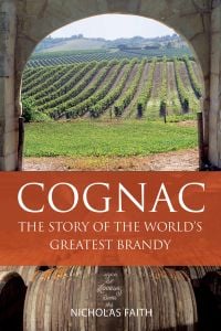 Book cover of Nicholas Faith's comprehensive guide, Cognac The Story of the World's Greatest Brandy, with a view of vineyards through an archway, with barrels below. Published by Academie du Vin Library.