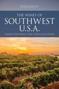 Book cover of Jessica Dupuy's guide, The Wines of Southwest U.S.A, with vineyards under a bright yellow sun. Published by Academie du Vin.