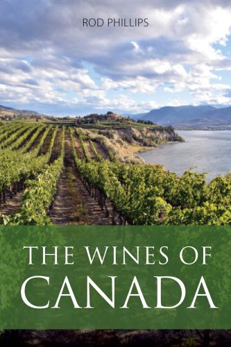 Book cover of Rod Phillips's guide, The Wines of Canada, with vineyards on the coast, mountains behind. Published by Academie du Vin Library.