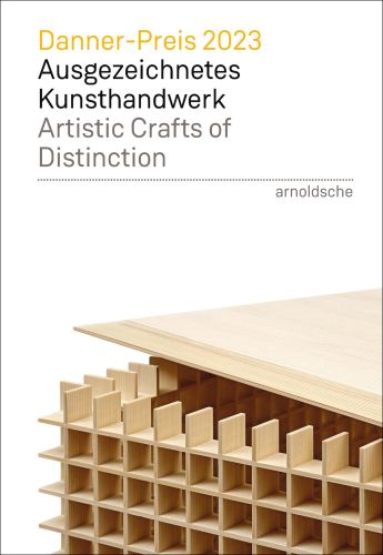 White book cover of Danner-Preis 2023 / Danner Prize 2023, Ausgezeichnetes Kunsthandwerk / Artistic Crafts of Distinction with a cube made of slats of wooden slates. Published by Arnoldsche Art Publishers.