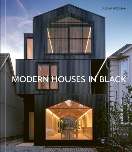 Black wooden lake house, surrounded by garden, in Berlin, on cover of 'Modern Homes in Black', by Images Publishing.