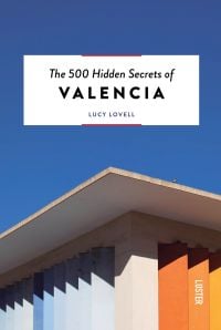 Guide book cover of The 500 Hidden Secrets of Valencia, with corner of building with blue and orange vertical slats. Published by Luster Publishing.