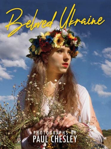 Ukrainian girl with long flowing hair and floral headpiece, on cover of 'Beloved Ukraine, Photographs by Paul Chesley', by ORO Editions.