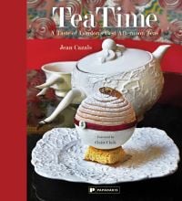 Book cover of Jean Cazals' TeaTime: A Taste of London's Best Afternoon Teas, with a tea cake dusted with icing sugar, and white teapot behind. Published by Papadakis.