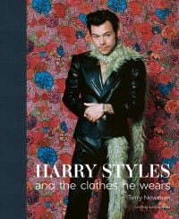Book cover of Terry Newman's fashion guide, Harry Styles and the clothes he wears, with the singer posing in black leather look suit, beige fur boa, with floral backdrop. Published by ACC Art Books.