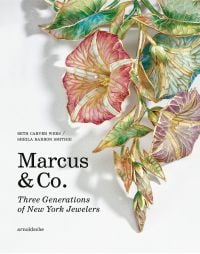 Book cover of Marcus & Co.: Three Generations of New York Jewelers, featuring an 18 Karat Gold, Plique-à-jour Enamel Pendant-Brooch and Chain. Published by Arnoldsche Art Publishers.