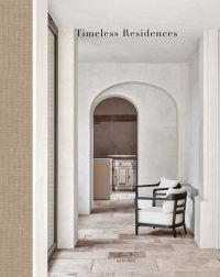 Book cover of Timeless Residences, with a pale interior hallway with stone tiled floor and two dark wood chairs with white upholstery. Published by Beta-Plus.