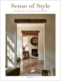 Book cover of Sense of Style: Artists & Creatives at Home, with an interior living room with white walls and wood flooring. Published by Beta-Plus.