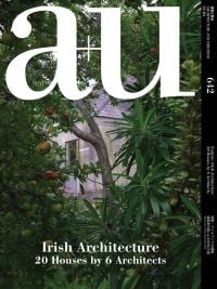 Book cover of a+u 24:03, 642: Feature: Irish Architecture 20 Houses by 6 Architects, with a grey residential house through green foliage. Published by Shinkenchiku-Sha Co., Ltd.