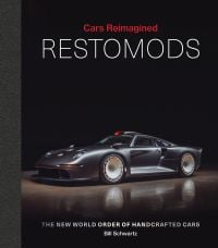 Book cover of Restomods: The New World Order of Handcrafted Cars, featuring a Carbon Porsche 935. Published by ACC Art Books.