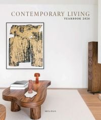 Book cover of Contemporary Living Yearbook 2026: featuring an interior with white walls, dark wood table and speaker stack. Published by Beta-Plus.