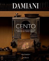 Book cover of Damiani: 100 X 100 Italiani, with the Mimosa Eternal Blue necklace with a sapphire from Sri Lanka surrounded by diamonds. Published by Silvana.