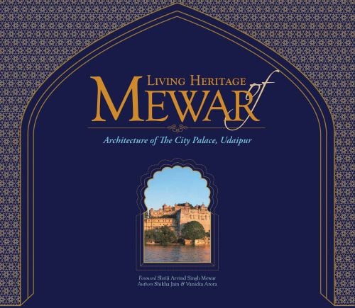 Book cover of Living Heritage of Mewar: Architecture of the City Palace, Udaipur, with a building surrounded by water. Published by Mapin Publishing.