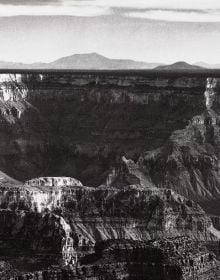 Book cover of Ansel Adams: The National Park Service Photographs, featuring the American National park with winding river and mountains behind. Published by Abbeville Press.